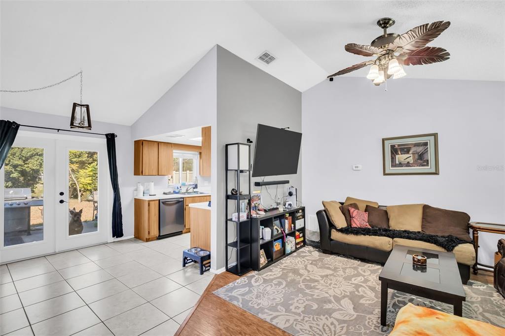 8425 Redfield Drive Port Richey, FL 34668 - Photo 2 of 13 a living room with furniture and a flat screen tv