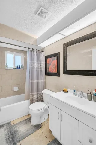 a bathroom with a sink a toilet and a bathtub