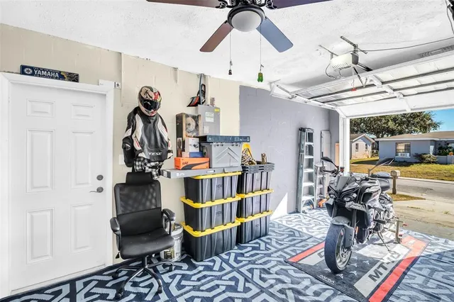 a living room with lots of furniture and a chandelier