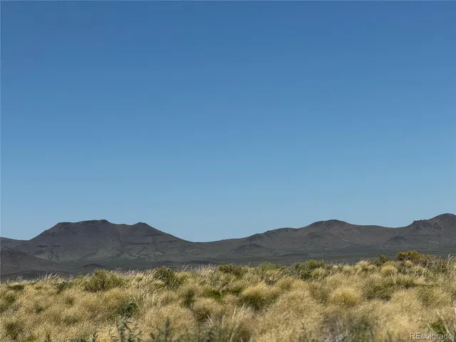 a view of mountains and valleys