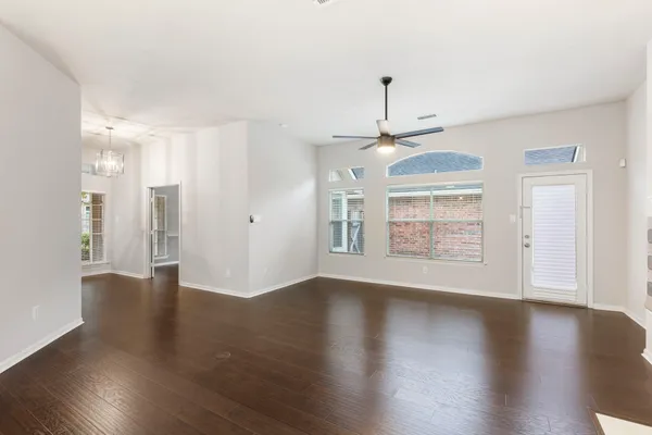 a kitchen with granite countertop stainless steel appliances a sink cabinets and a counter top space