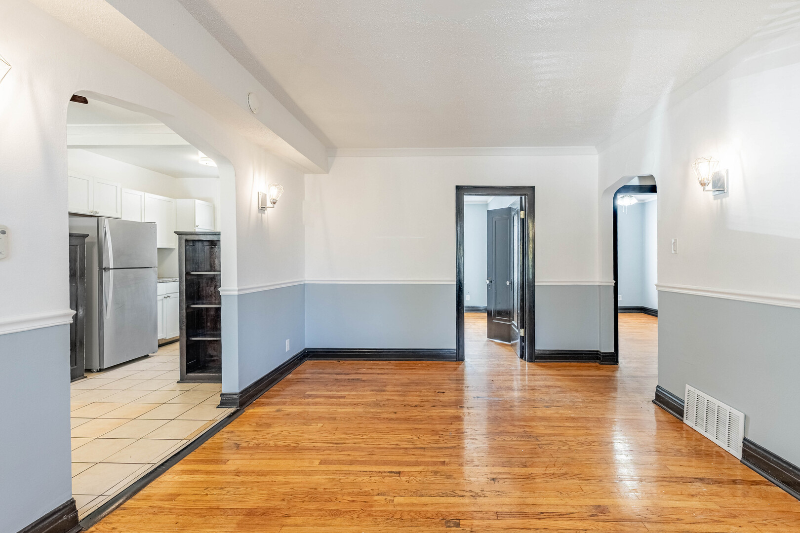 2453 West 56th Street, Unit R1 Chicago, IL 60629 - Photo 5 of 14 a view of empty room with wooden floor