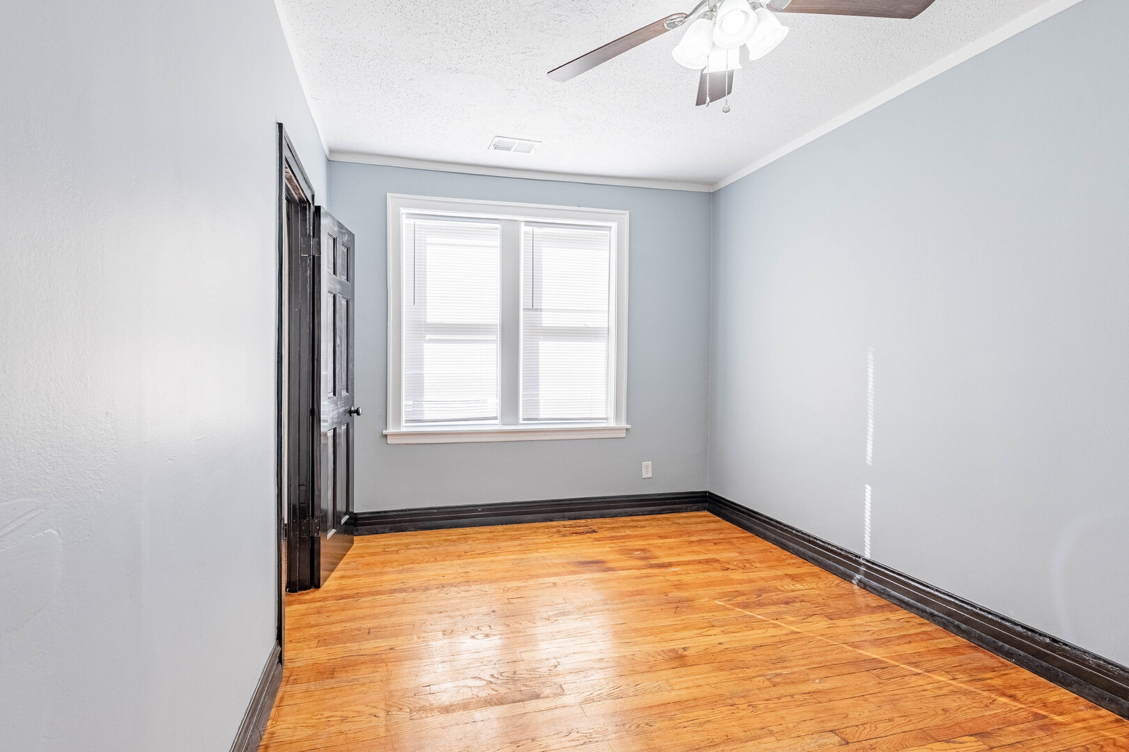 2453 West 56th Street, Unit R1 Chicago, IL 60629 - Photo 7 of 14 an empty room with a window