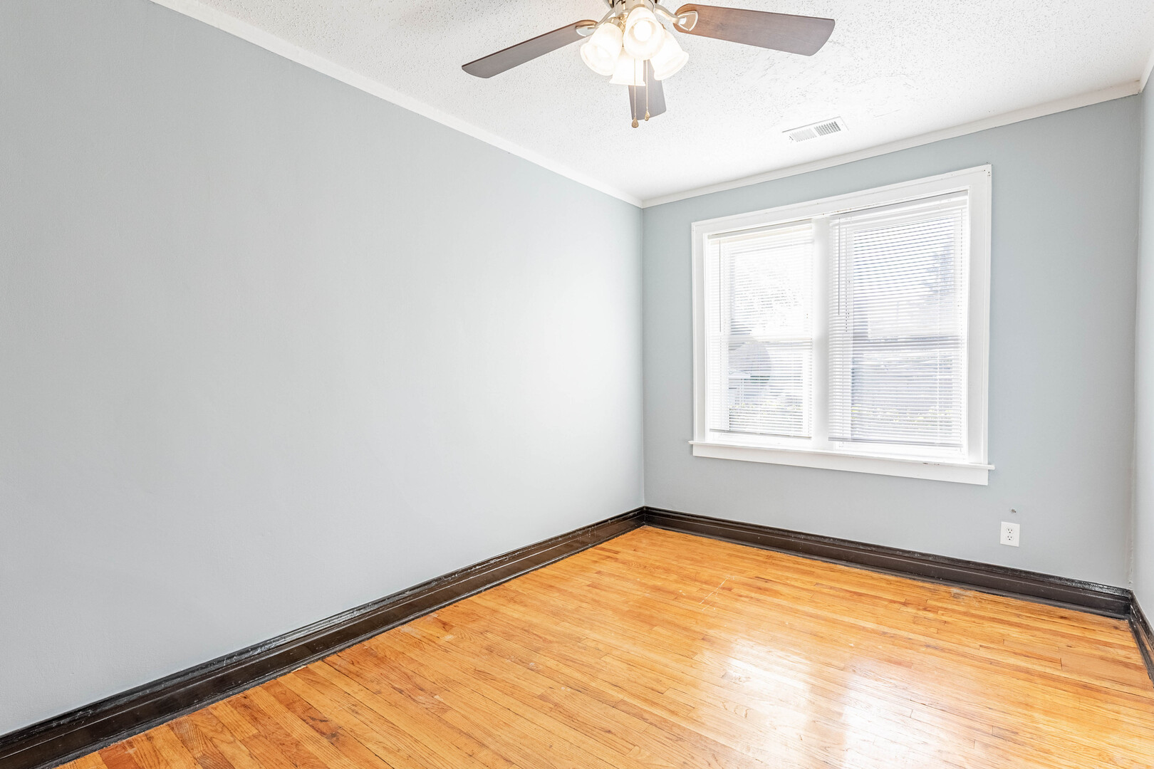 2453 West 56th Street, Unit R1 Chicago, IL 60629 - Photo 9 of 14 an empty room with a window