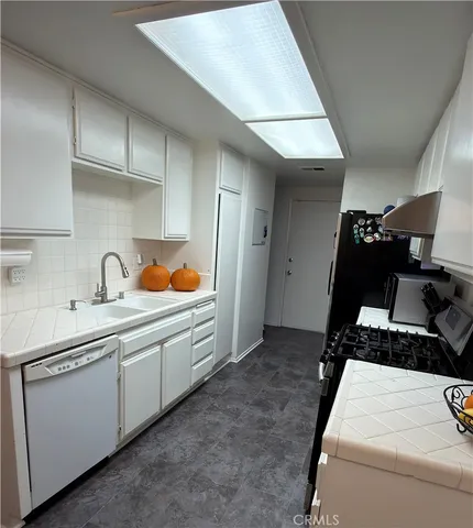 a kitchen with a sink and cabinets