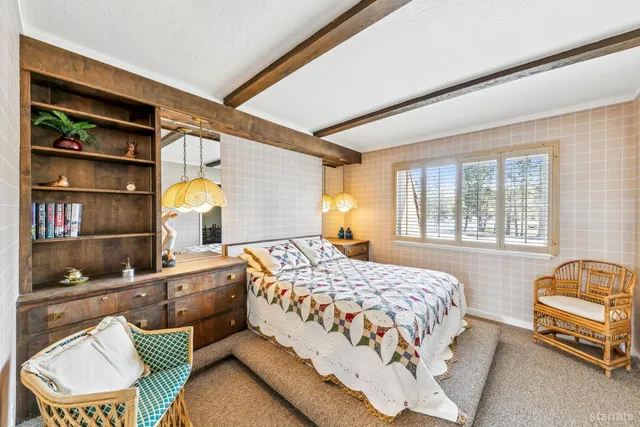 a bathroom with a granite countertop toilet a sink and a mirror