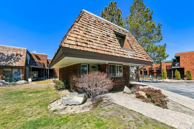 a view of a house with backyard porch and sitting area