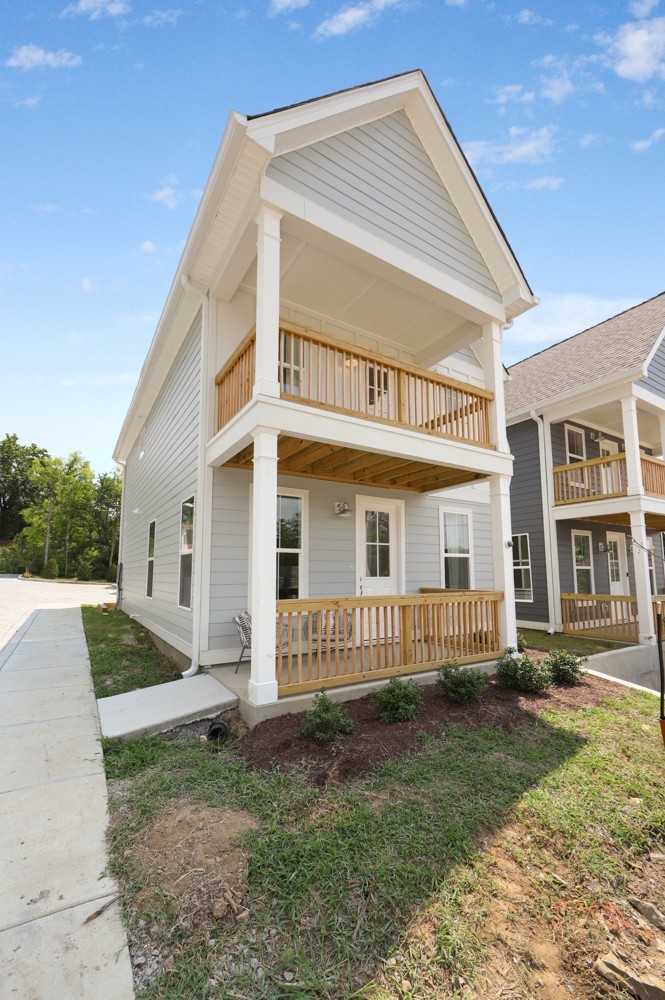 422 Creative Way Madison, TN 37115 - Photo 2 of 42 a front view of a house with garden