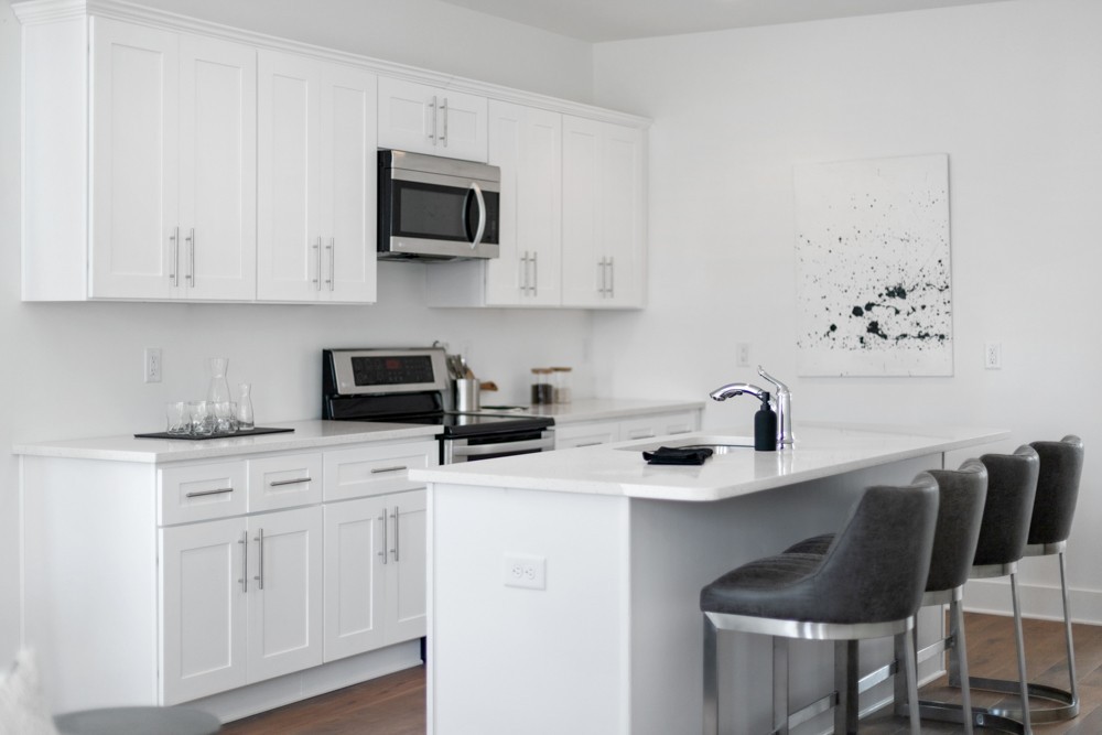 422 Creative Way Madison, TN 37115 - Photo 32 of 42 a kitchen with stainless steel appliances granite countertop a sink a stove and white cabinets