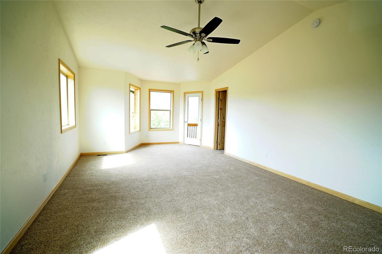 311 Quartz Circle Bailey, CO 80421 - Photo 15 of 30 a view of a livingroom with a ceiling fan and window