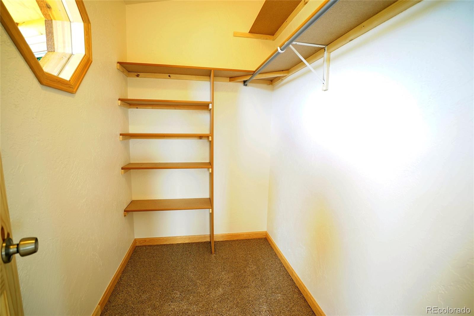 311 Quartz Circle Bailey, CO 80421 - Photo 16 of 30 a view of a room with racks on the wall