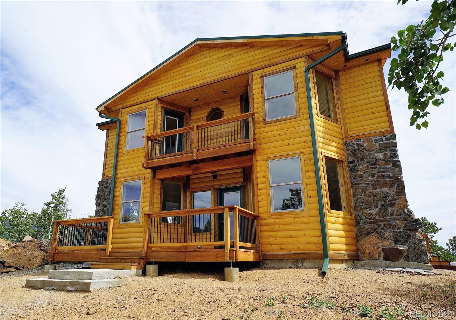 311 Quartz Circle Bailey, CO 80421 - Photo 2 of 30 a front view of a house