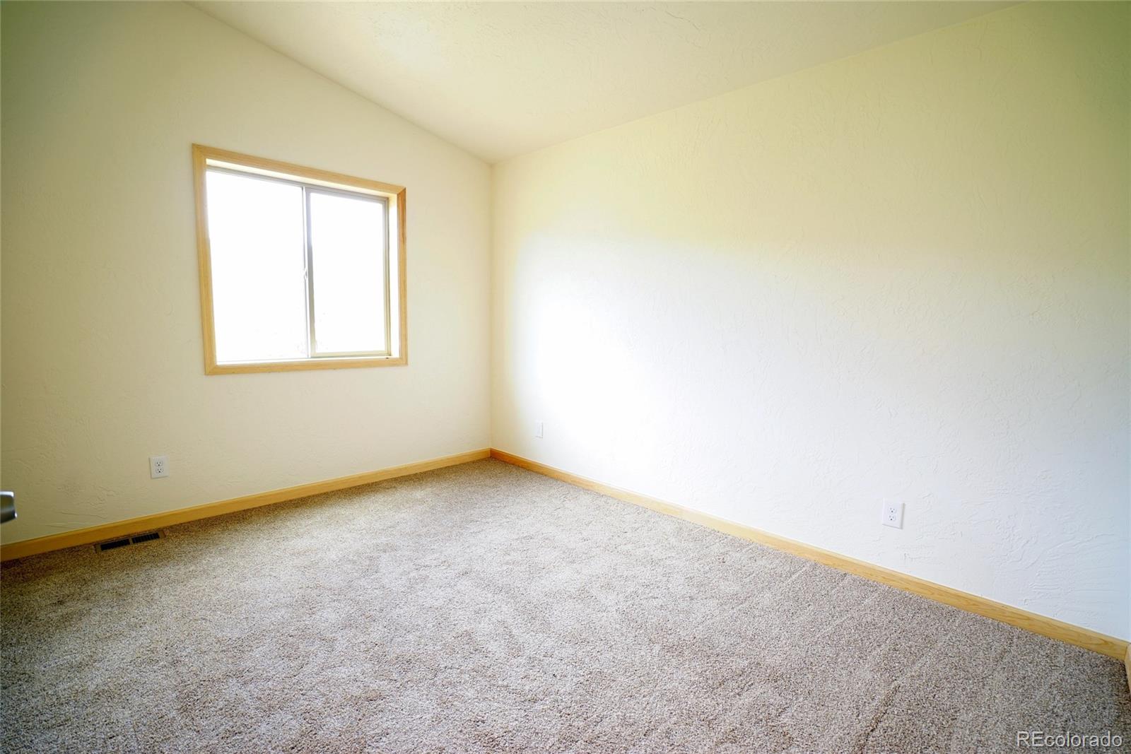 311 Quartz Circle Bailey, CO 80421 - Photo 21 of 30 an empty room with a window