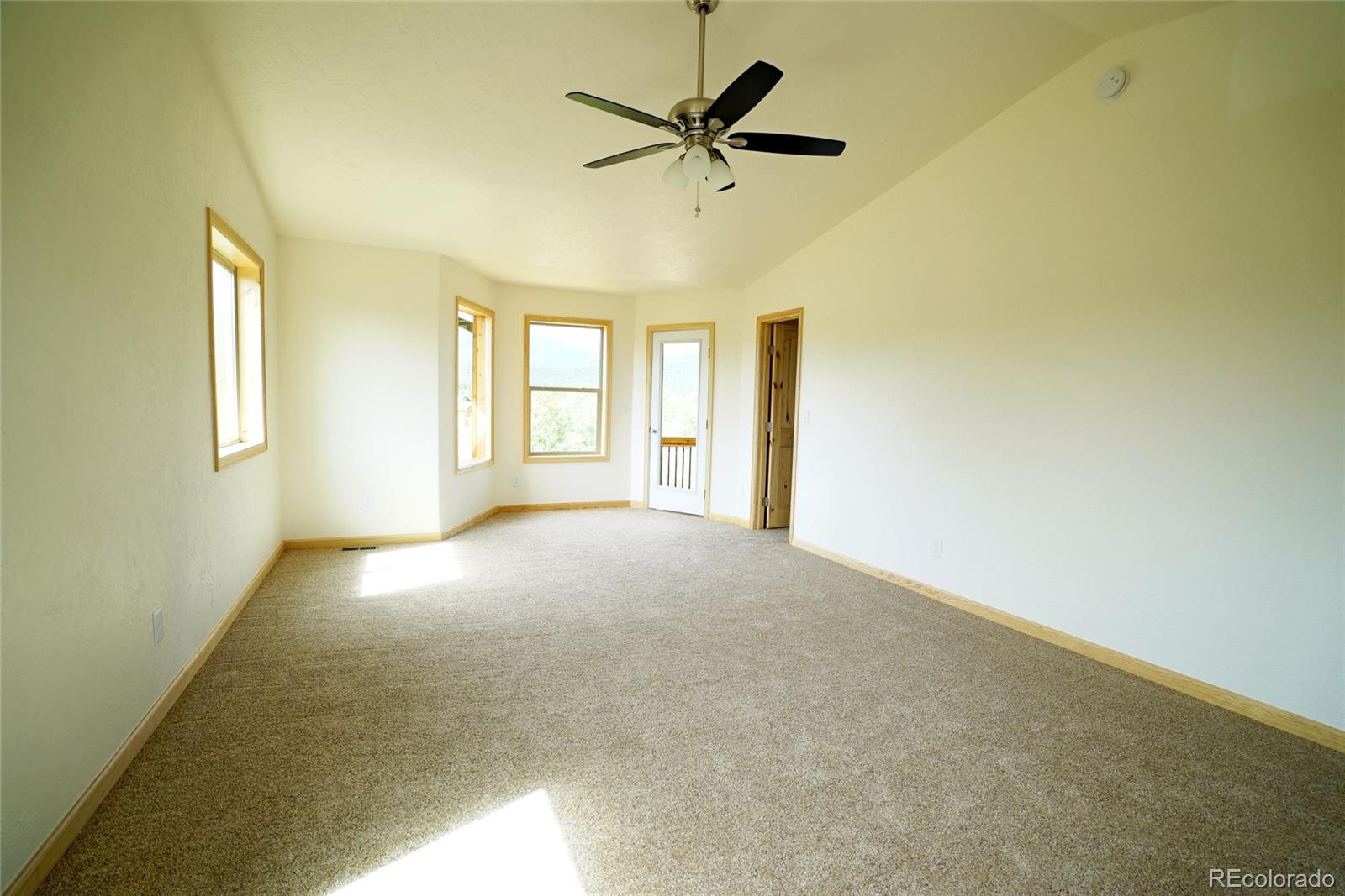 311 Quartz Circle Bailey, CO 80421 - Photo 23 of 30 a view of a livingroom with a ceiling fan and window