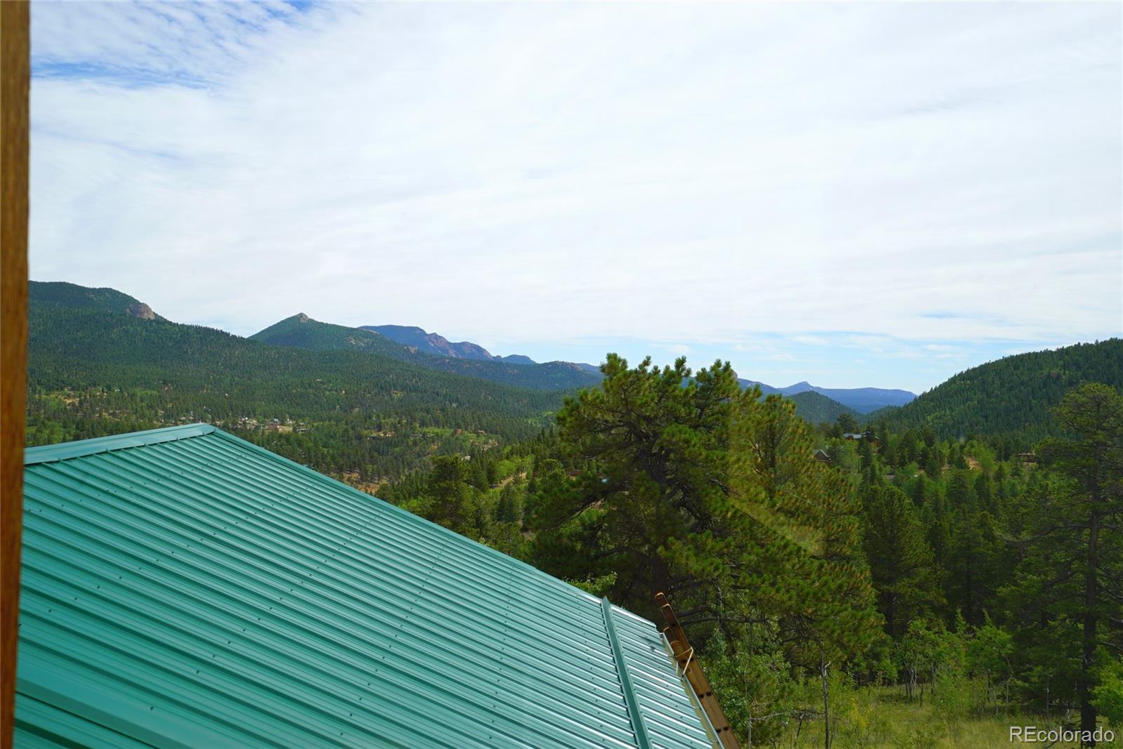 311 Quartz Circle Bailey, CO 80421 - Photo 24 of 30 a view of a balcony with an outdoor space