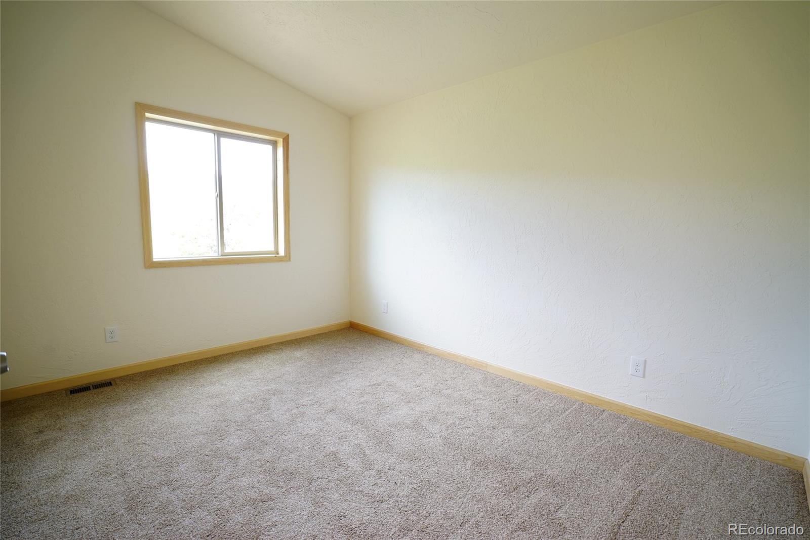 311 Quartz Circle Bailey, CO 80421 - Photo 26 of 30 an empty room with a window