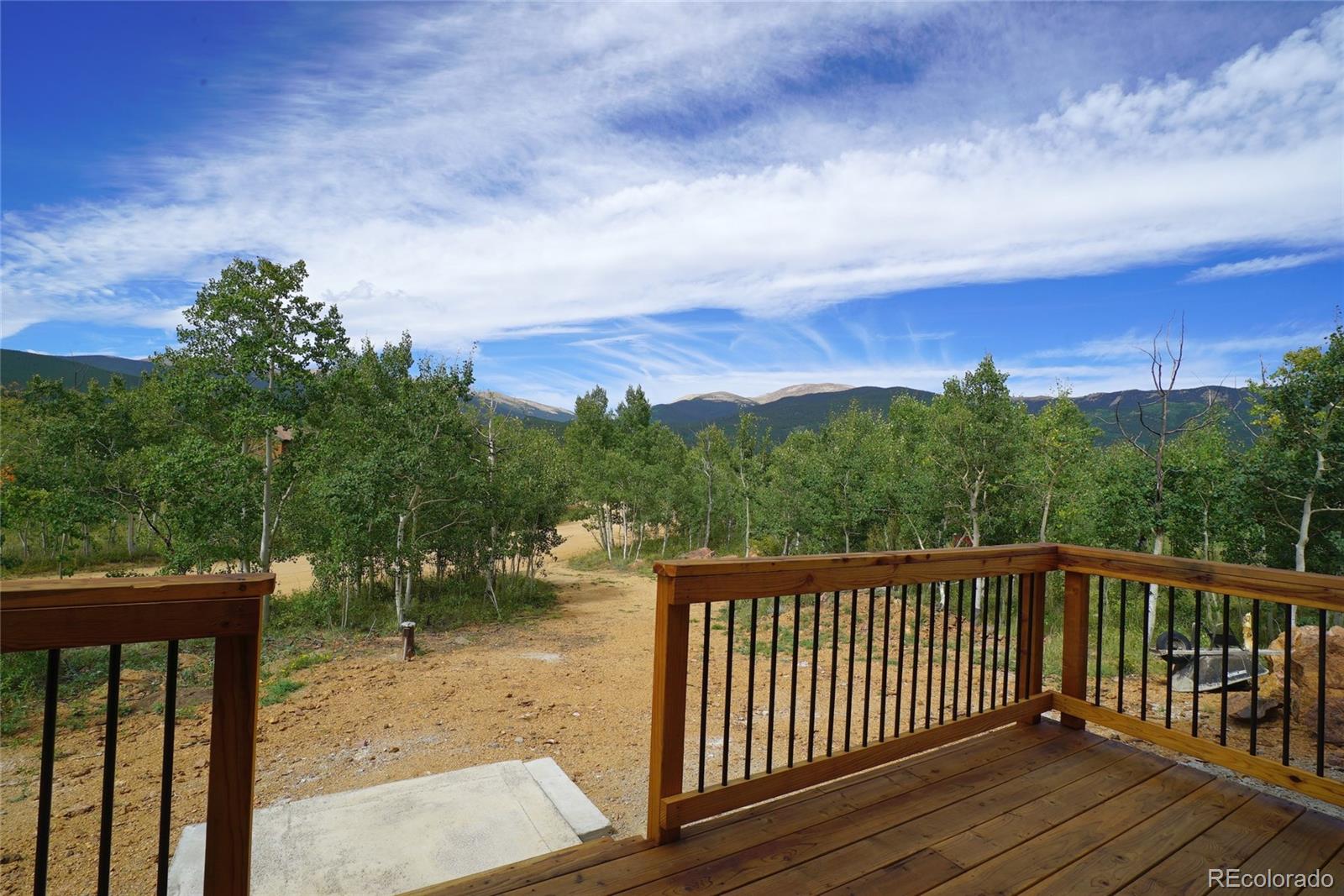 311 Quartz Circle Bailey, CO 80421 - Photo 29 of 30 a balcony with wooden floor and fence