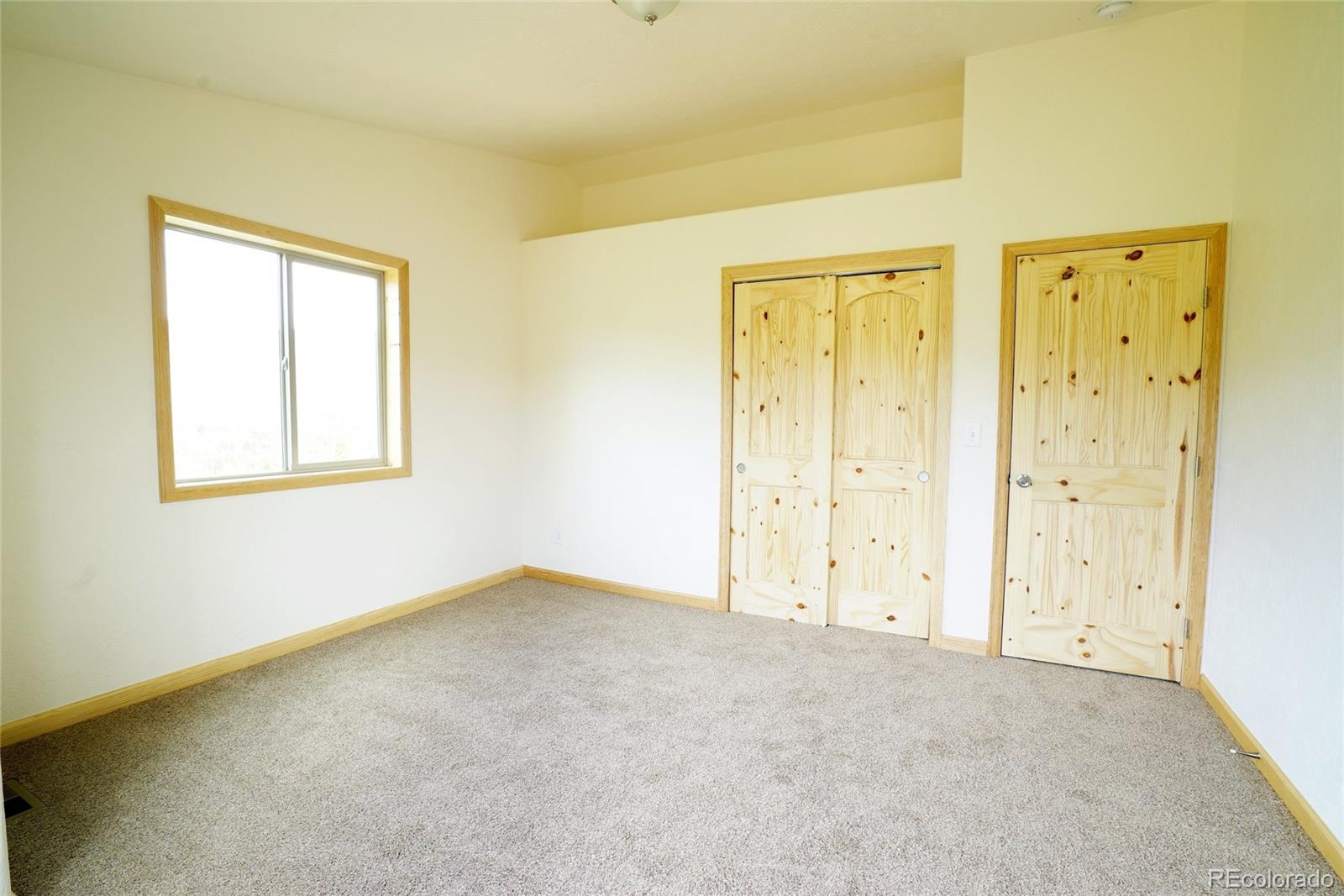 311 Quartz Circle Bailey, CO 80421 - Photo 4 of 30 an empty room with windows