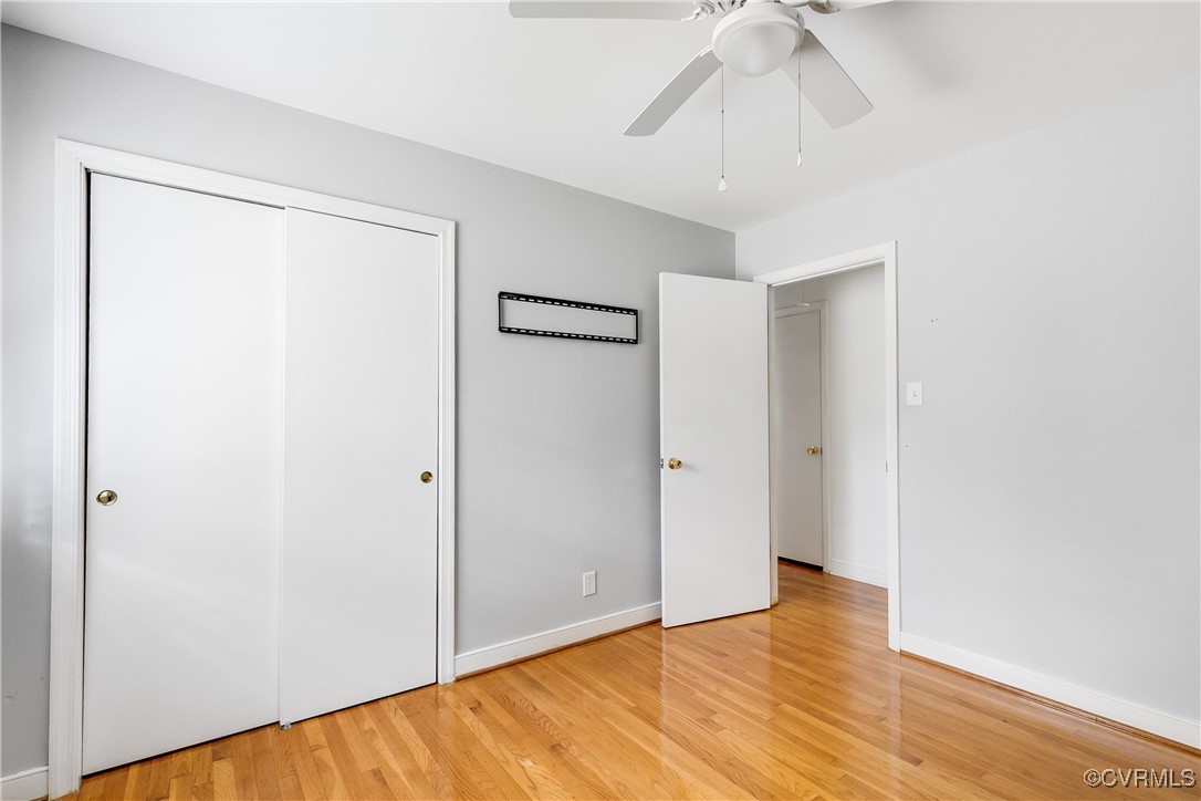 12860 Singer Road Midlothian, VA 23112 - Photo 26 of 39 Unfurnished bedroom with a closet, hardwood / wood