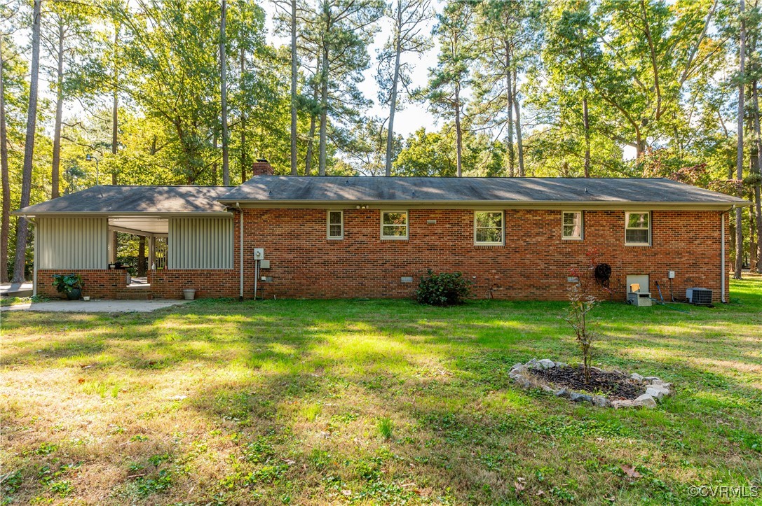 12860 Singer Road Midlothian, VA 23112 - Photo 38 of 39 Back of house with a yard