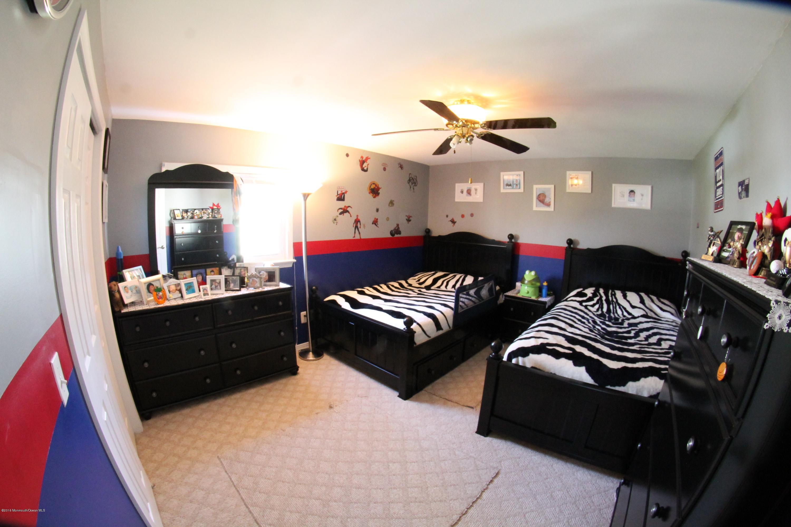 13 Partree Road Jackson, NJ 08527 - Photo 11 of 17 a living room with furniture and a mirror