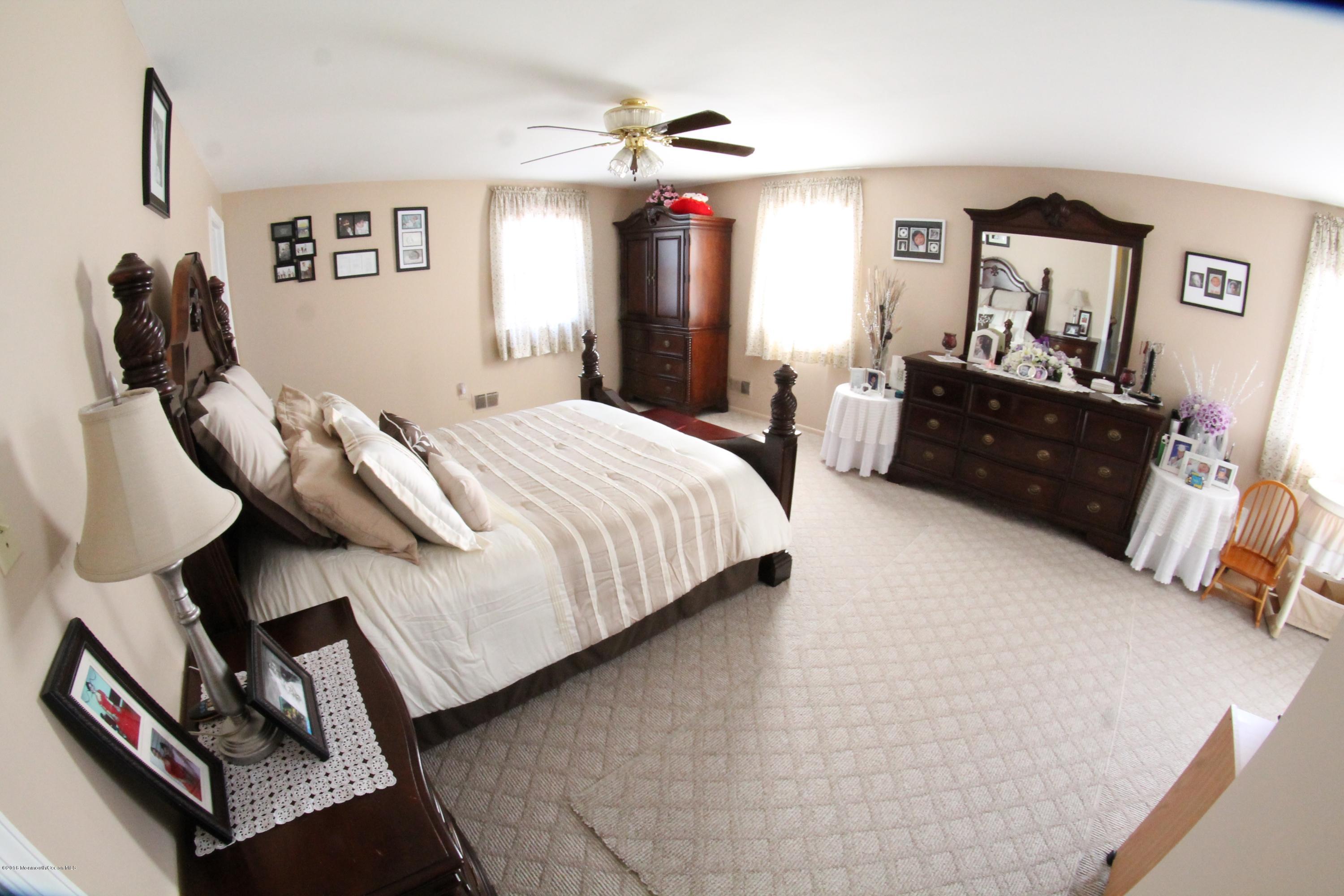 13 Partree Road Jackson, NJ 08527 - Photo 12 of 17 a bedroom with a bed and dresser
