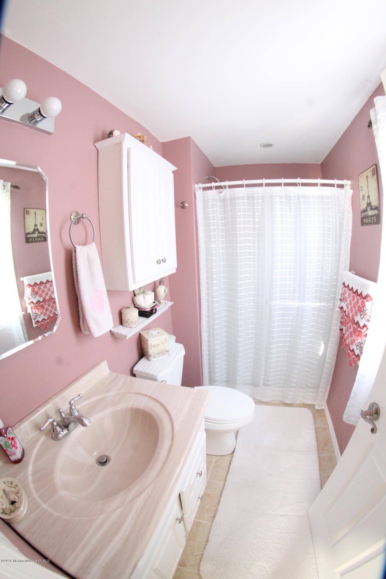 13 Partree Road Jackson, NJ 08527 - Photo 14 of 17 a bathroom with a sink and a mirror