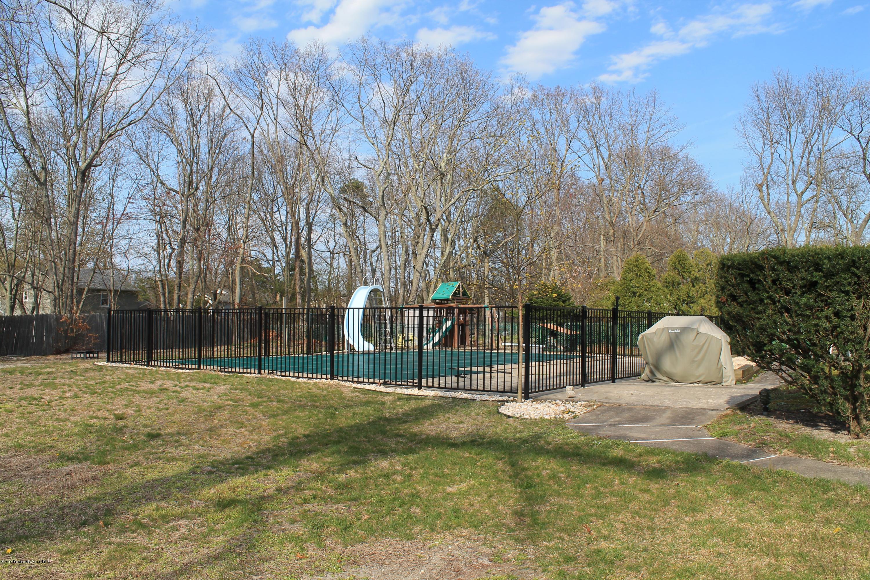 13 Partree Road Jackson, NJ 08527 - Photo 16 of 17 a view of outdoor space with deck and trees