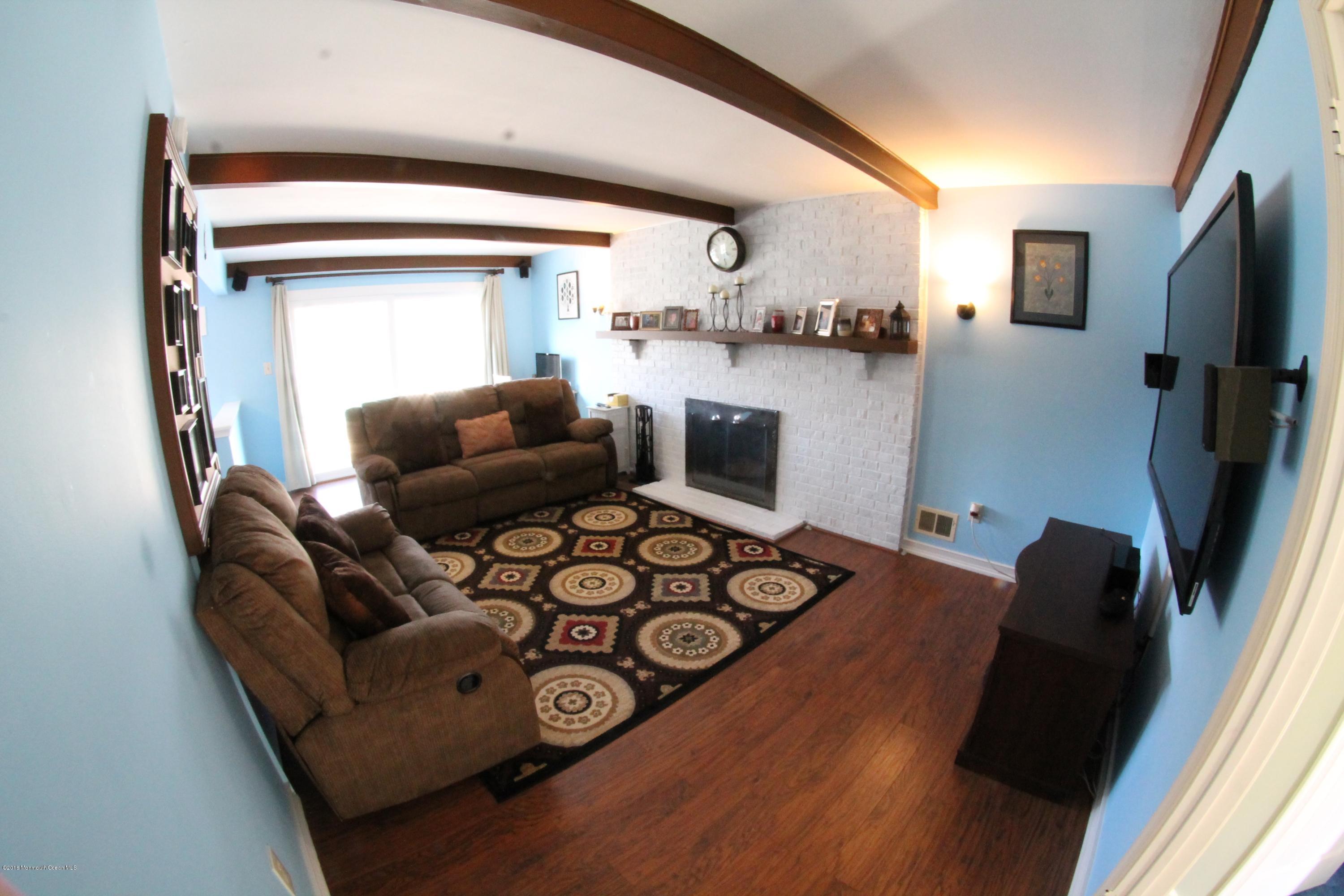 13 Partree Road Jackson, NJ 08527 - Photo 4 of 17 a living room with furniture and a flat screen tv