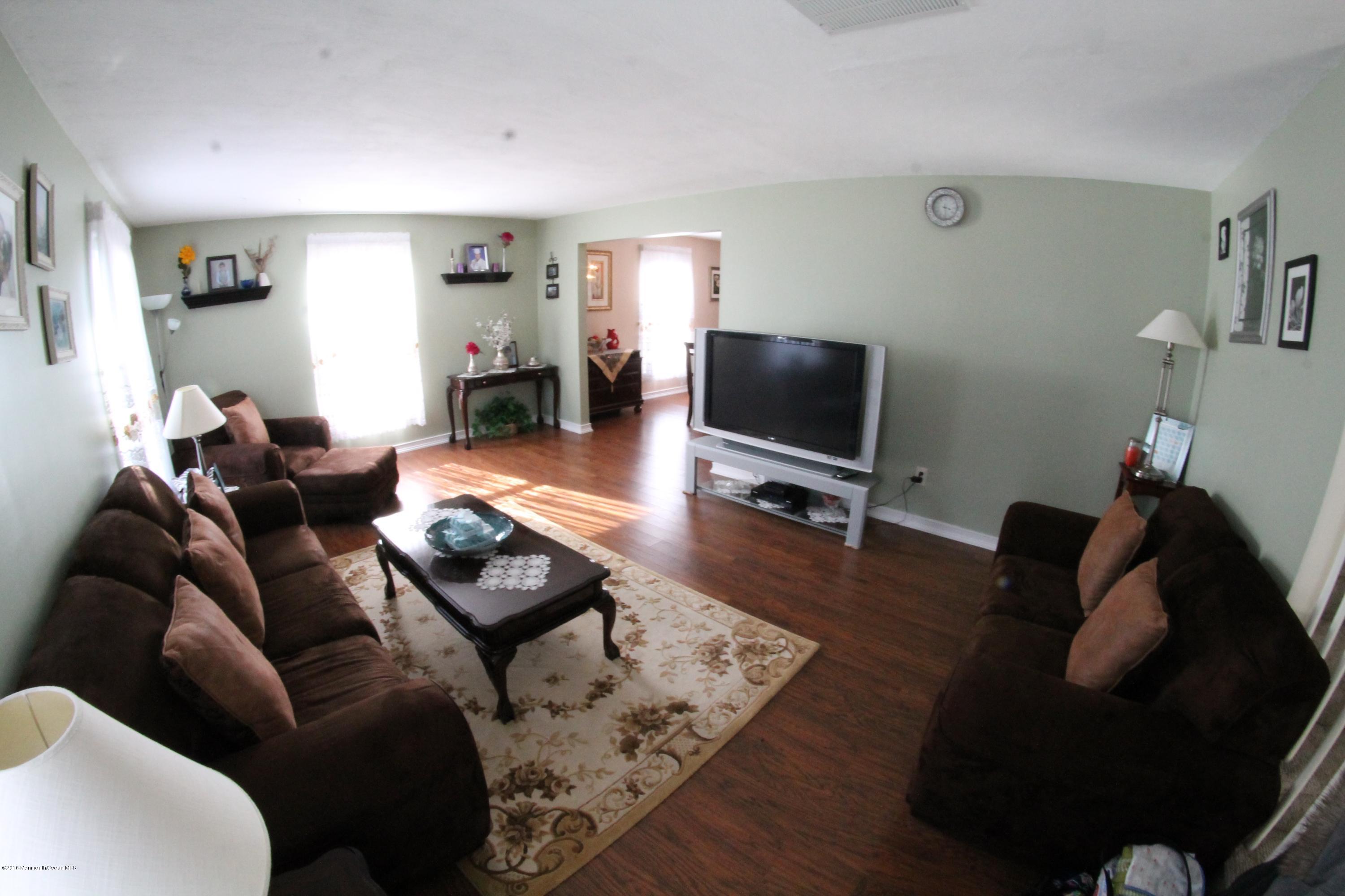 13 Partree Road Jackson, NJ 08527 - Photo 7 of 17 a living room with furniture and a flat screen tv