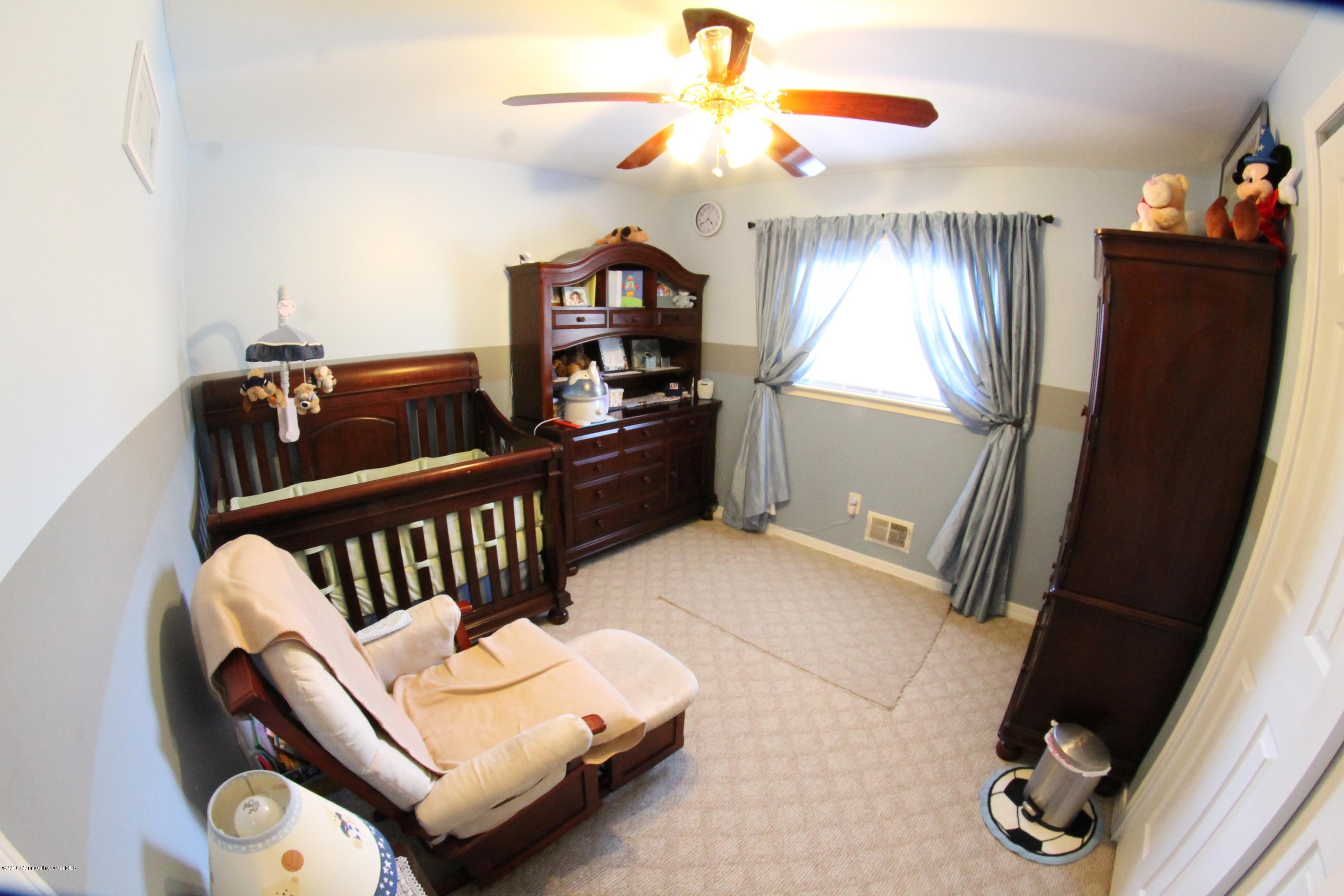 13 Partree Road Jackson, NJ 08527 - Photo 9 of 17 a bedroom with furniture and a window