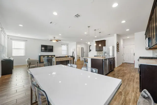 a view of a house with a yard and pathway