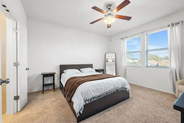 a large kitchen with kitchen island a stove a sink a dining table and chairs