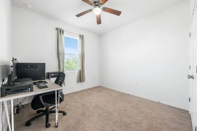 a spacious bathroom with a double vanity sink a large mirror and shower