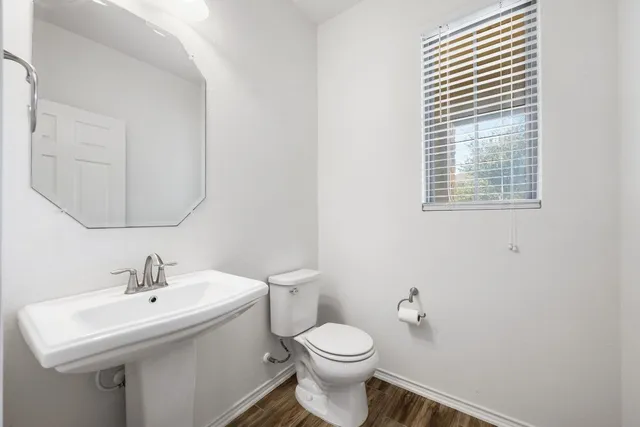 a bedroom with a bed and chair