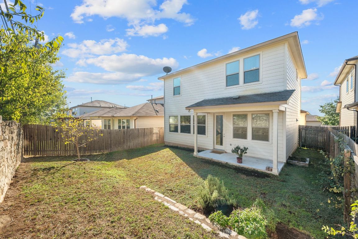 1902 Tasmanian Tiger Trace Austin, TX 78728 - Photo 23 of 29 a view of a house with backyard and sitting area