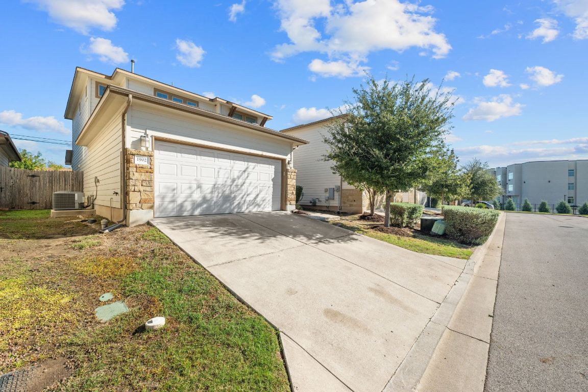 1902 Tasmanian Tiger Trace Austin, TX 78728 - Photo 25 of 29 a view of a house with a yard and pathway