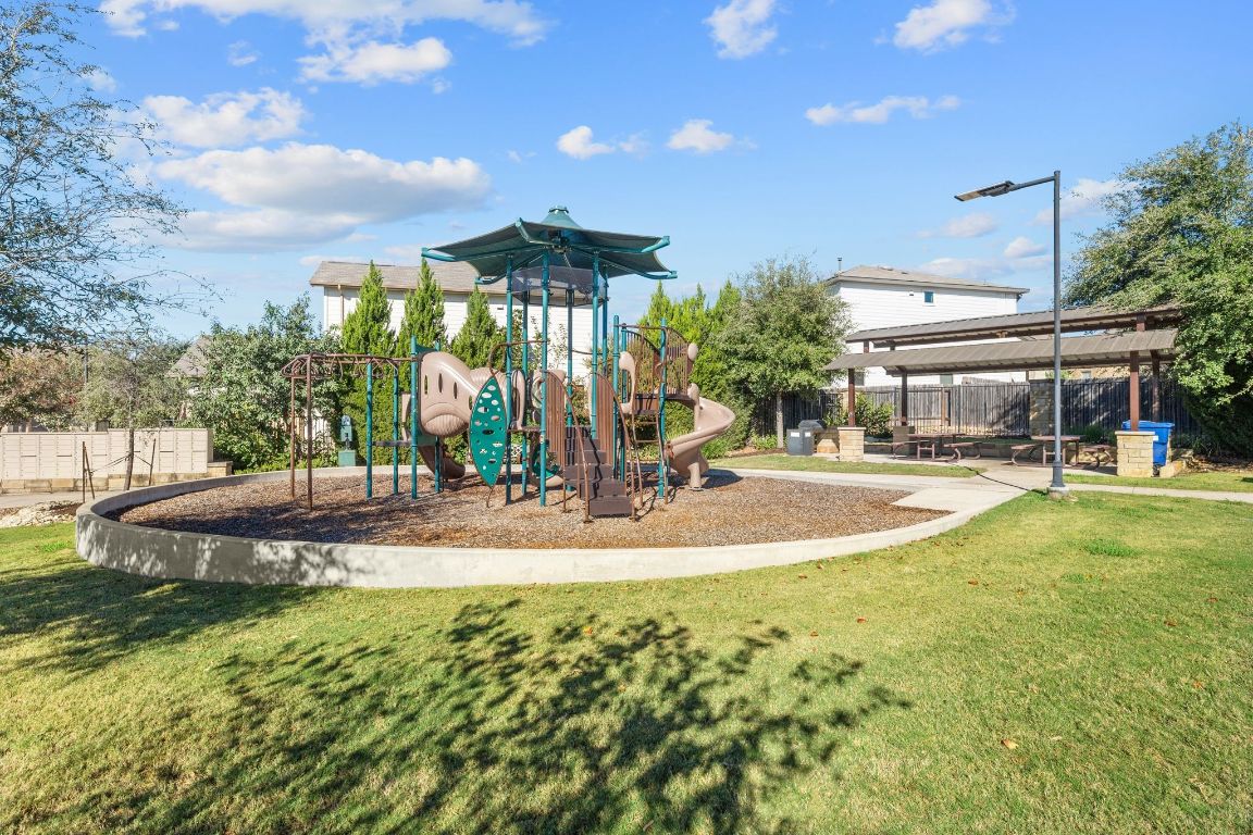 1902 Tasmanian Tiger Trace Austin, TX 78728 - Photo 26 of 29 a view of a swimming pool with an outdoor seating