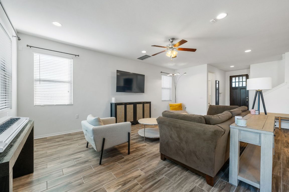 1902 Tasmanian Tiger Trace Austin, TX 78728 - Photo 3 of 29 a living room with furniture and a flat screen tv