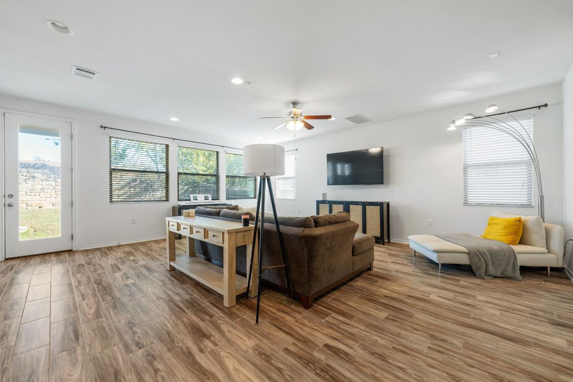 1902 Tasmanian Tiger Trace Austin, TX 78728 - Photo 5 of 29 a living room with furniture and a flat screen tv