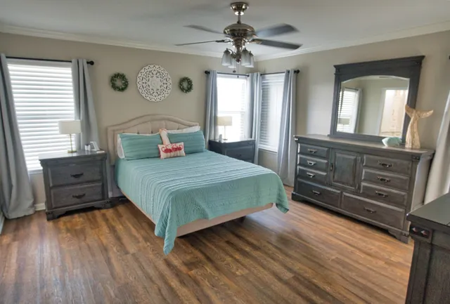 a bedroom with a bed and a dresser