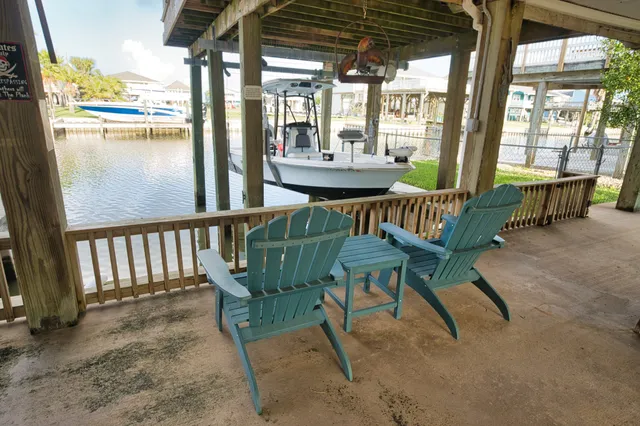 a view of a chairs and table in the patio