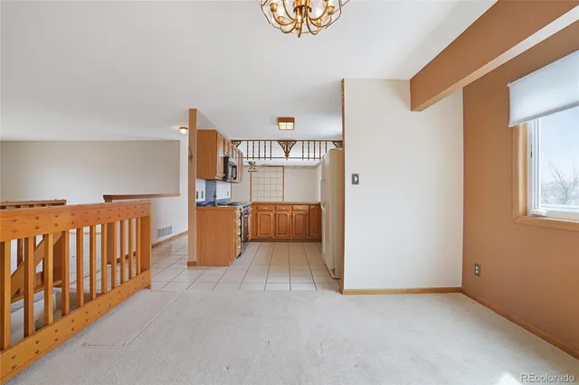 a kitchen with a sink and a refrigerator