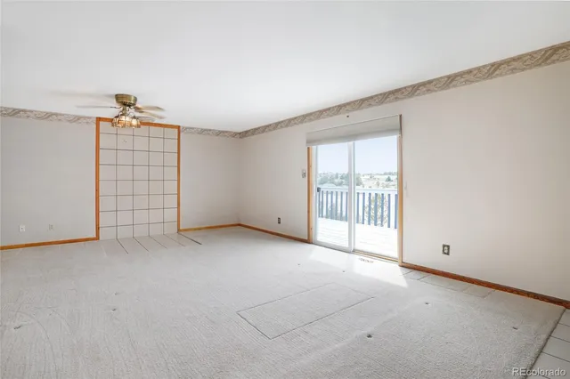 a view of an empty room and window
