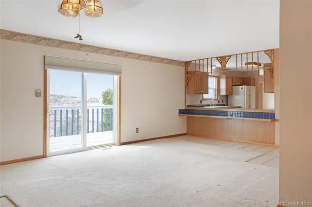 a view of an empty room with closet area