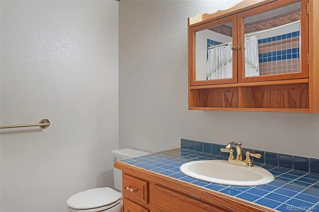 an empty room with a ceiling fan and a window