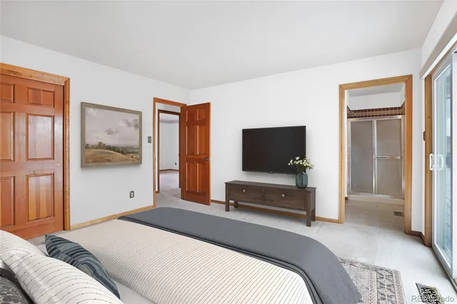 a room with furniture pool table and windows