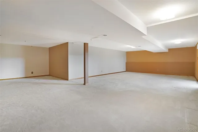 a view of a big room with carpet