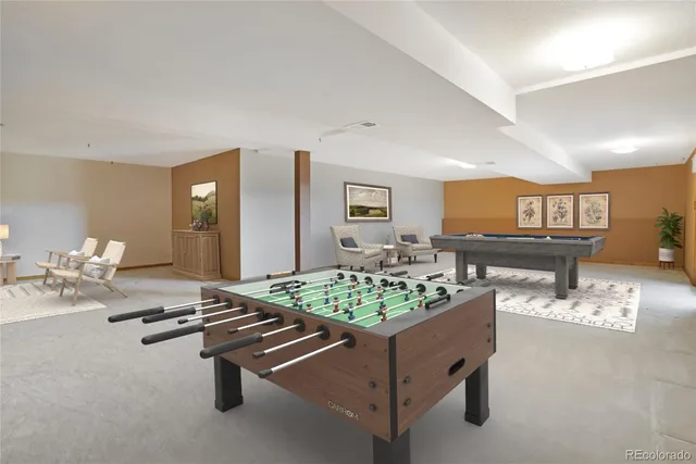 a view of a livingroom with furniture and a table