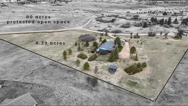 a front view of a building with a yard